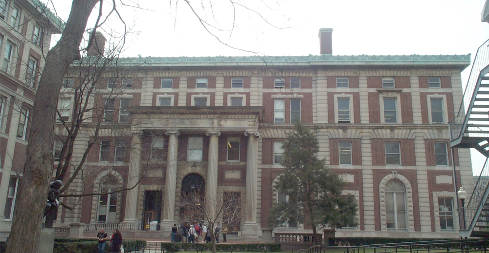 The exterior of Kent Hall with people walking towards its entrance