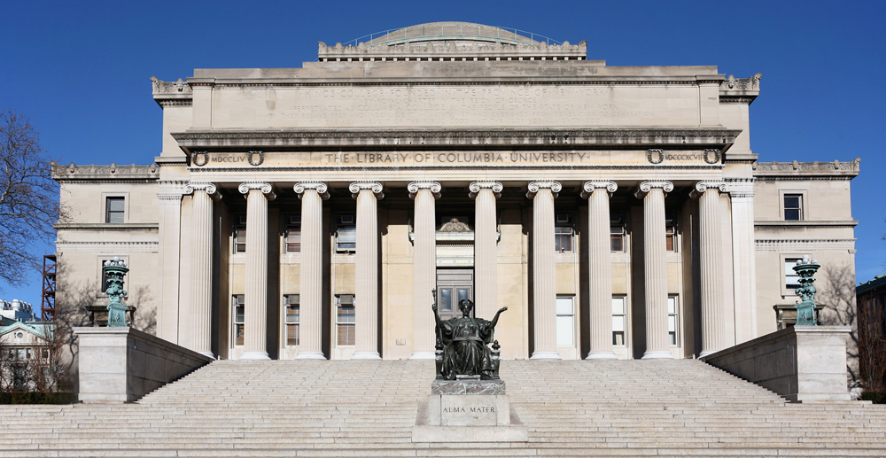 A view of the exterior of Low Library on a sunny, cloudless day