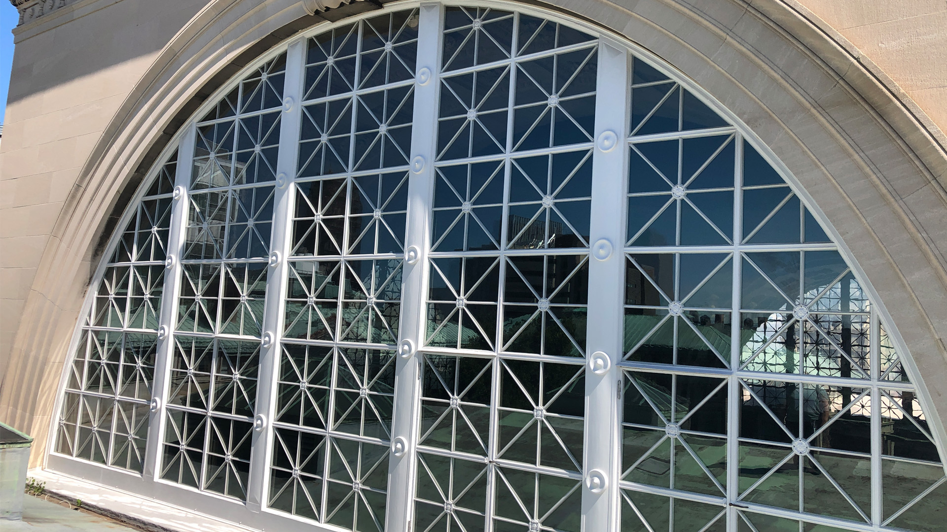 A view of the restored monumental arch window that is on the roof dome of Low Library.