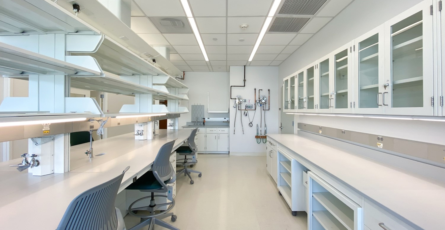 A white, modern research lab that has no equipment installed in it.