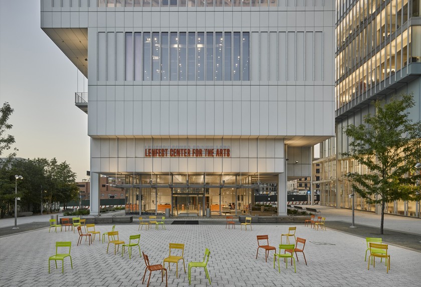 Lenfest exterior, glass and concrete structure, with courtyard and chairs in front