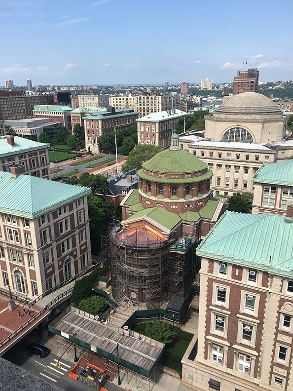 An aerial view of the Chapel, showing scaffolding around the building and the copper apse roof installed.