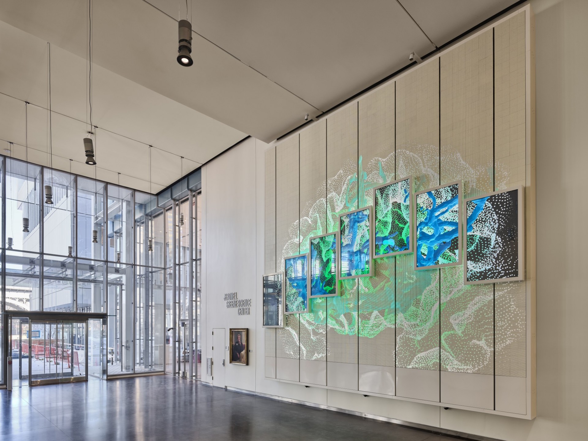 The JLG Science Center lobby, showing a colorful display on a wall. 