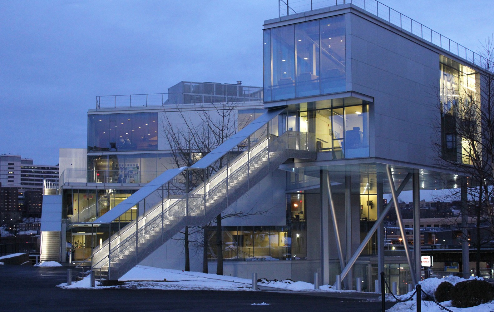 A rear view of the Campbell Sports Center at dusk.