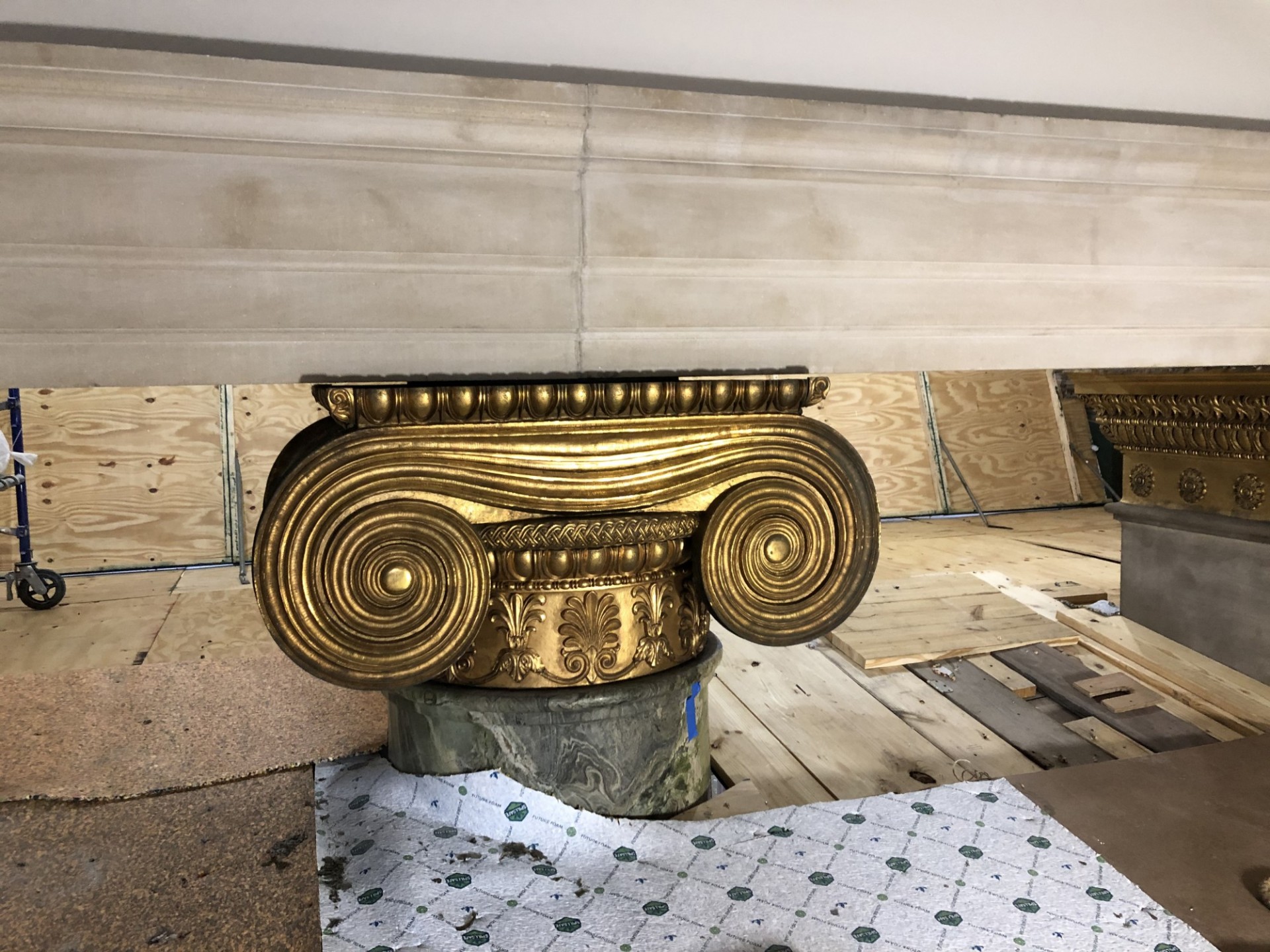 A gilded bronze column capital cleaned and restored.