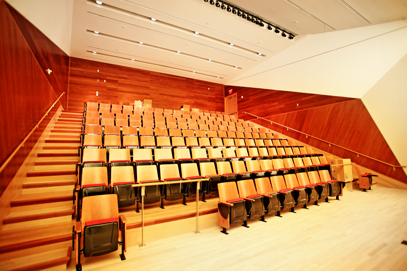 Northwest Corner Building interior, wood-paneled fifth floor lecture hall room with more than 100 wooden seats