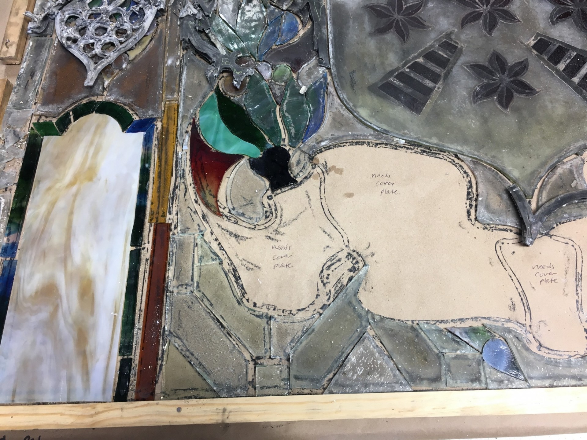 Sixteen stained-glass windows from the dome were sent to a conservation studio for cleaning and repairs. Stained glass window under repair