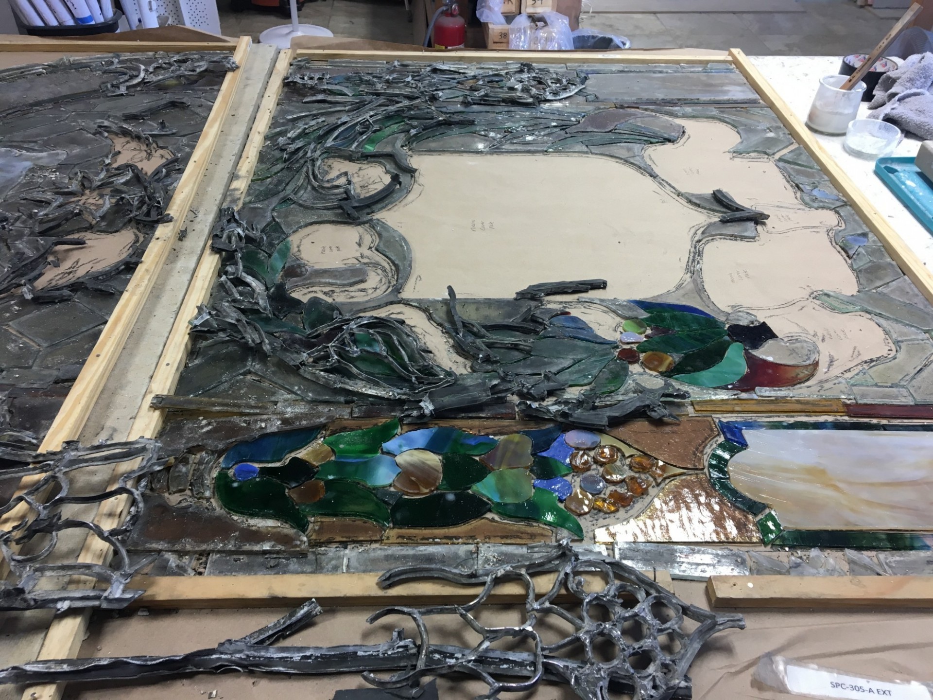 Sixteen stained-glass windows from the dome were sent to a conservation studio for cleaning and repairs. One of the sixteen damaged and dirty stained glass windows