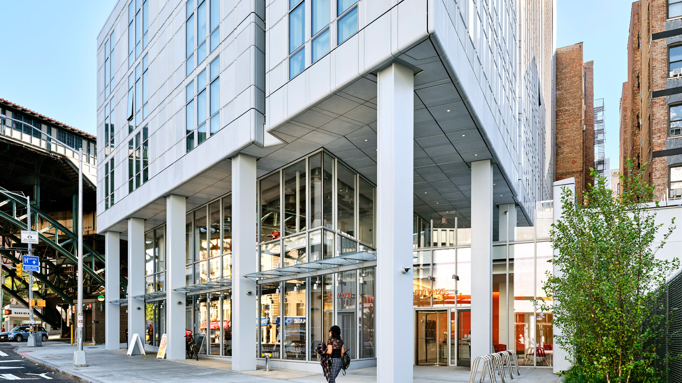 A view of the ground and lower floors of 600 W. 125th Street from the corner of the building looking southeast.