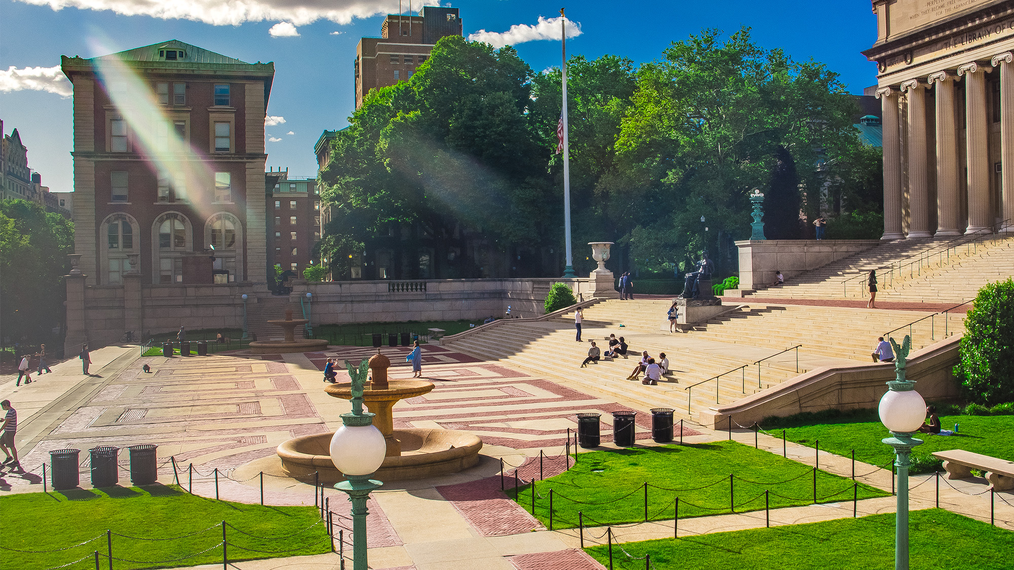 A view of Low Plaza during a sunny day with Dodge Hall in the background.