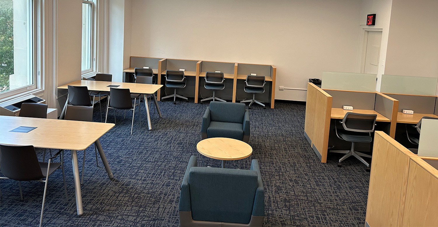 The Mathematics Library, with a couple of tables alongside the windows and rows of private workstations along the wall.