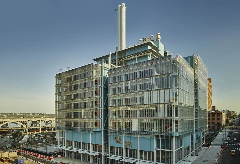 Jerome L. Greene Science Center exterior, glass and steel structure against cloudless blue sky