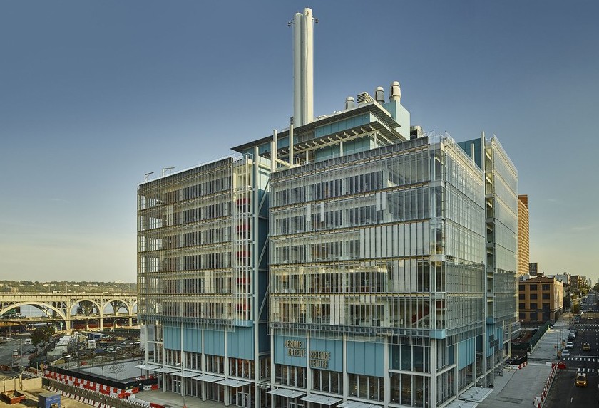 Jerome L. Greene Science Center exterior, glass and steel structure against cloudless blue sky