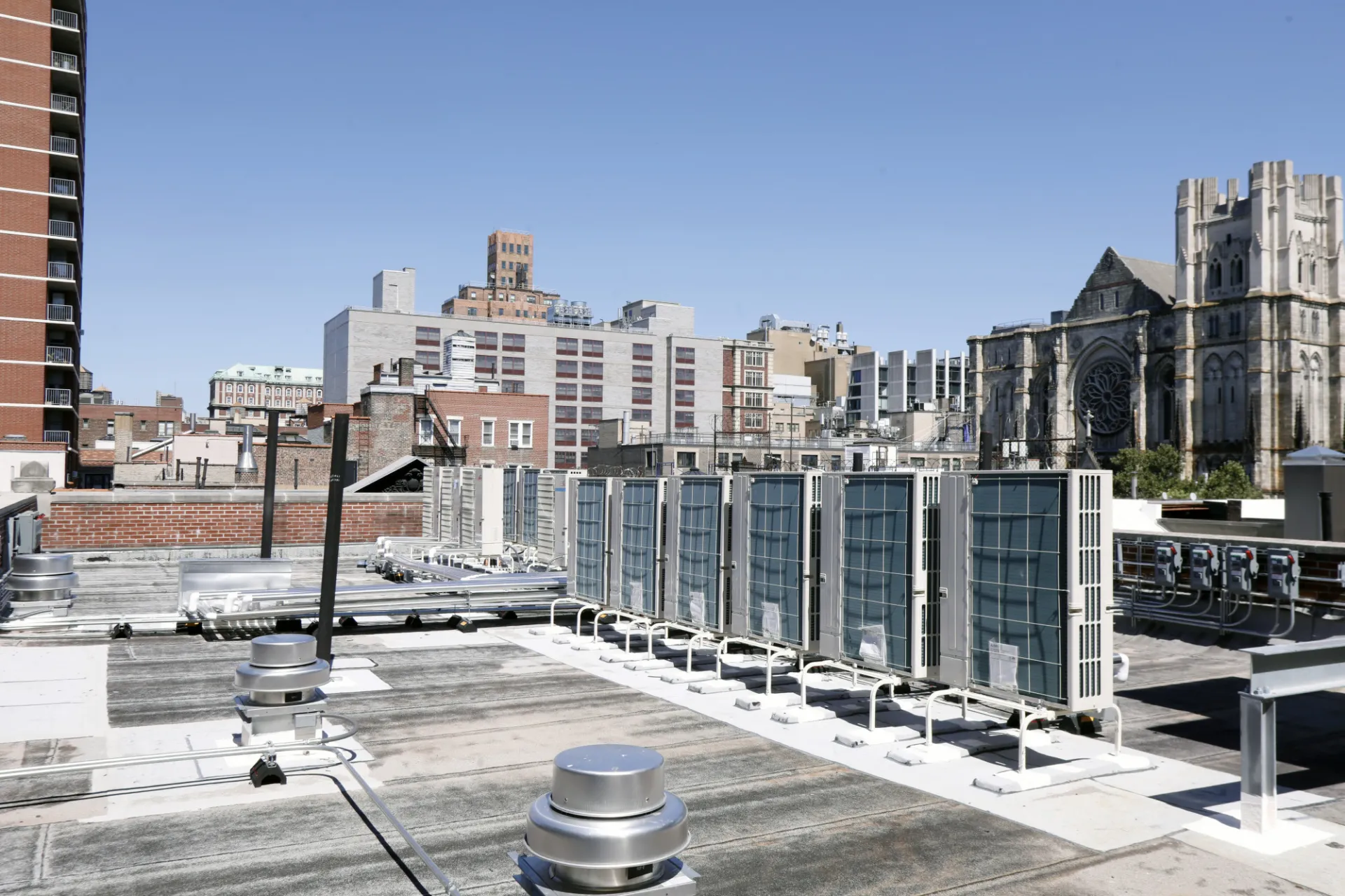 Equipment on the roof of 518 W. 111th Street with St. John the Divine in the background.