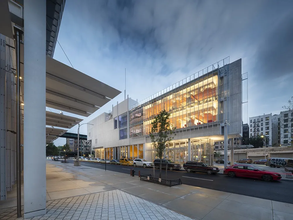 Exterior shot of The Forum, a wedge-shaped concrete and glass structure. 