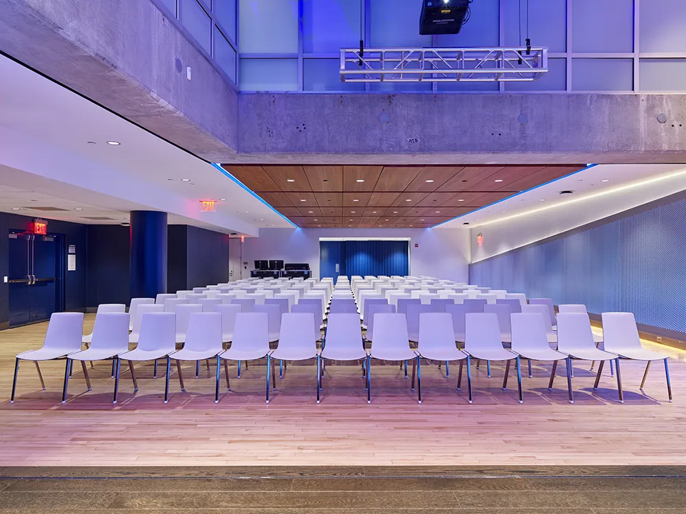 A view of the row of white chairs to the back of the Wang Pavilion.