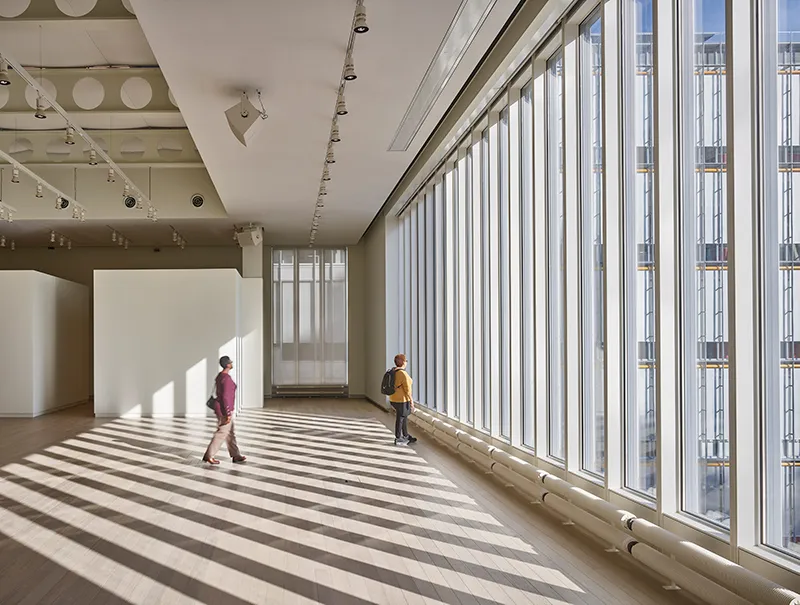 Lenfest Lantern Room: Two people stand near floor-to-ceiling glass windows.