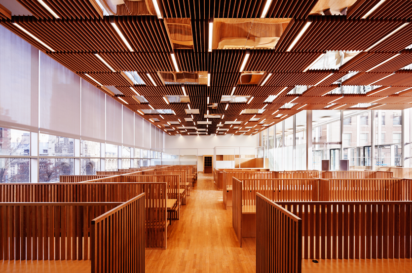 Reading carrels in the fourth floor library Northwest Corner Building interior, rows of wooden reading carrels in the fourth floor lobby